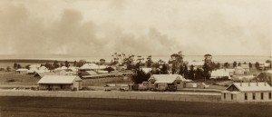 Sorell township c1920 - looking south over sale yards and train station in centre, bushfire smoke from in the distance